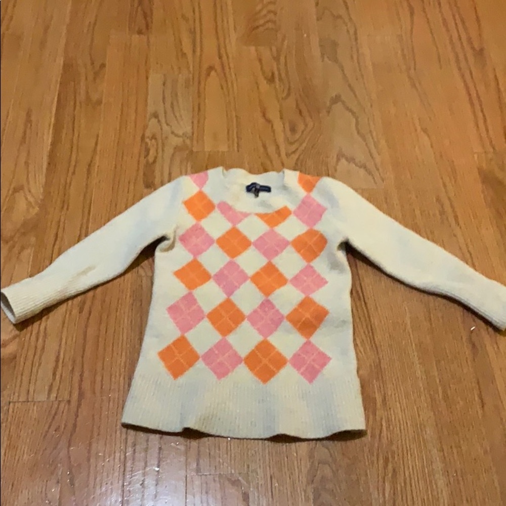 Cream argyle sweater size Small 78% wool 22% nylon